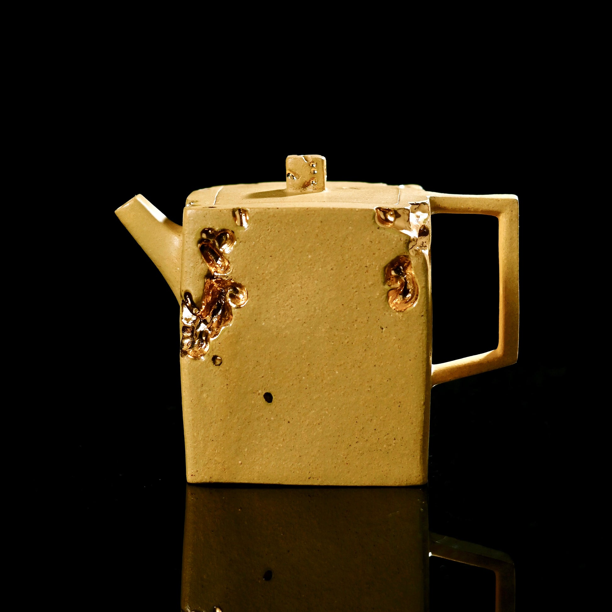 Yixing Golden Section Zisha clay square teapot showcasing rare material and geometric form