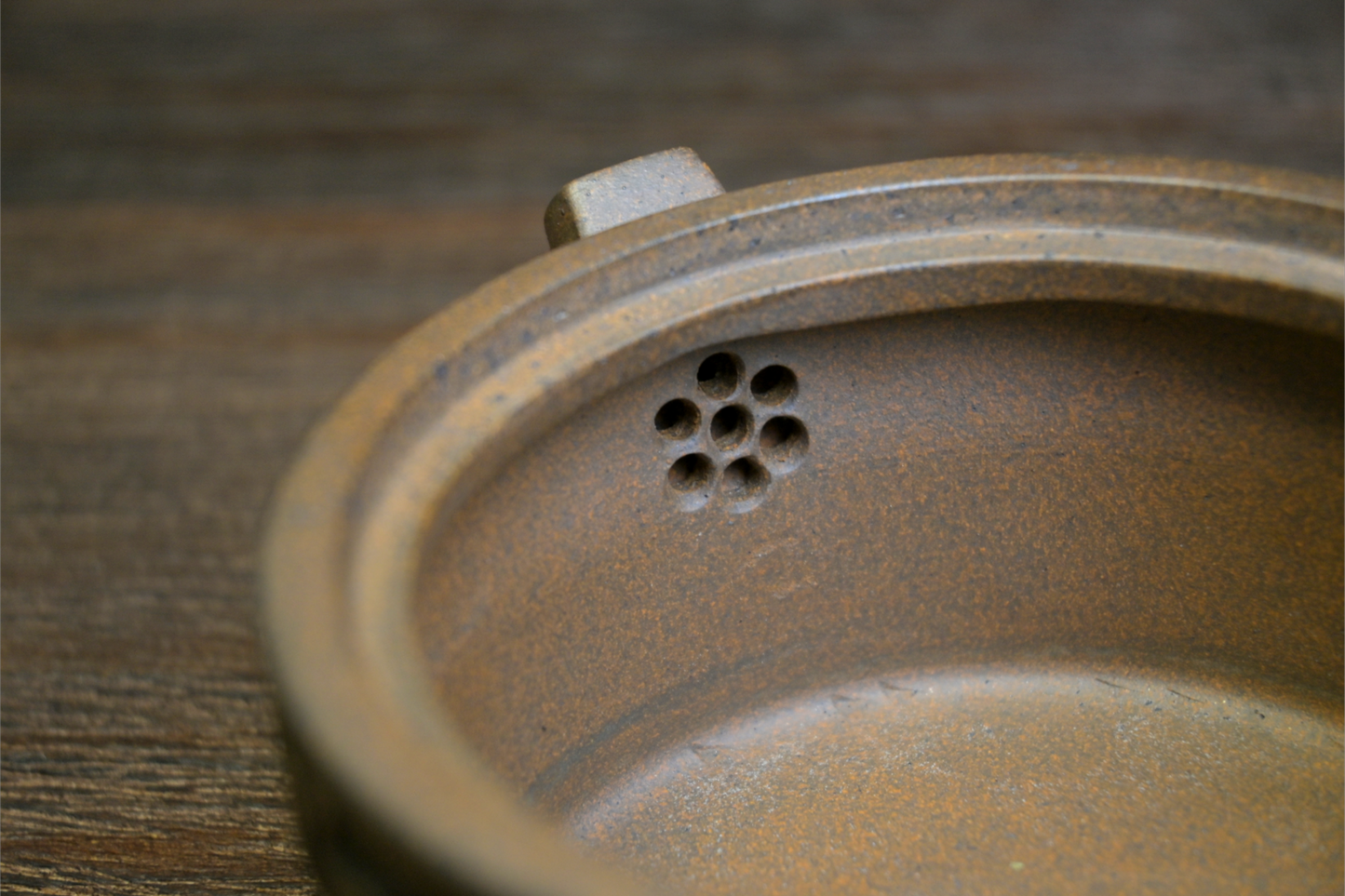 Yixing wood-fired teapot with graceful curves and balanced form, showcasing the natural beauty of purple clay ceramics