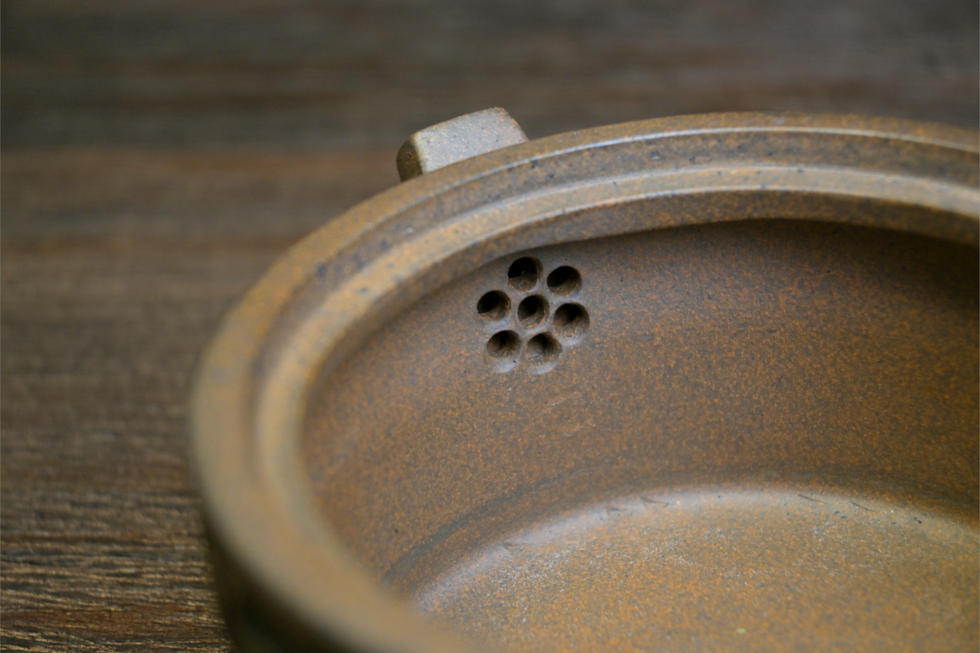 Yixing wood-fired teapot with graceful curves and balanced form, showcasing the natural beauty of purple clay ceramics