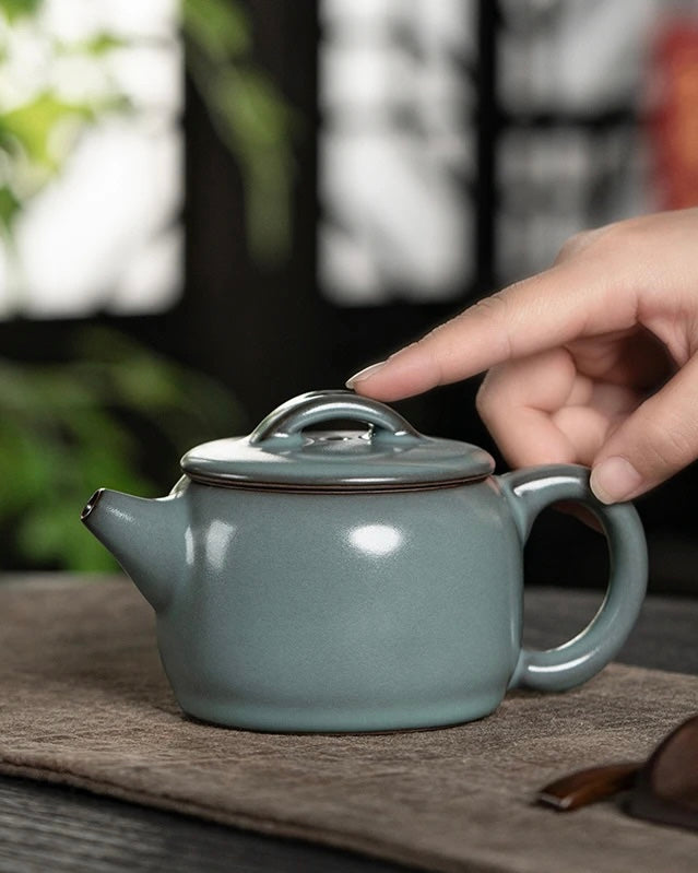 Han Wa shaped Longquan celadon teapot made from iron clay with non-crackle glaze