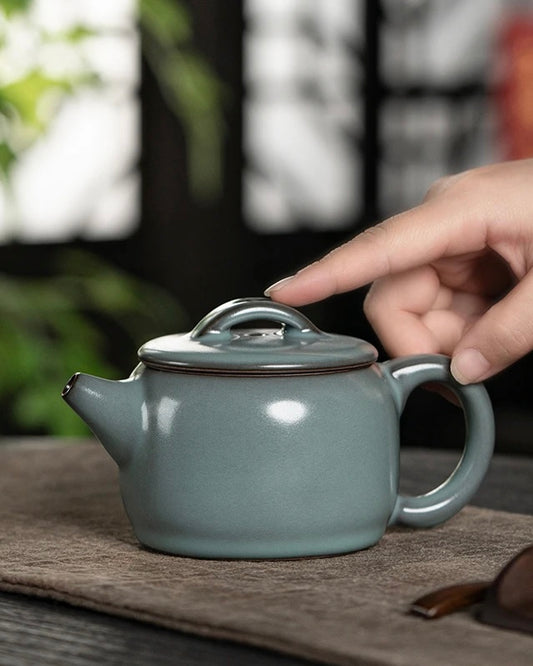 Han Wa shaped Longquan celadon teapot made from iron clay with non-crackle glaze