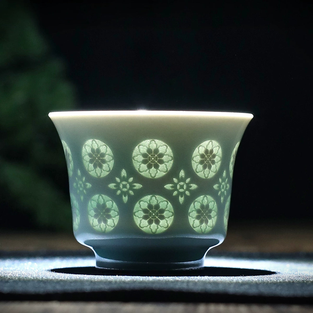 Traditional Chinese Longquan celadon master cup in Matibei horse-hoof shape showing light-filtering lattice design
