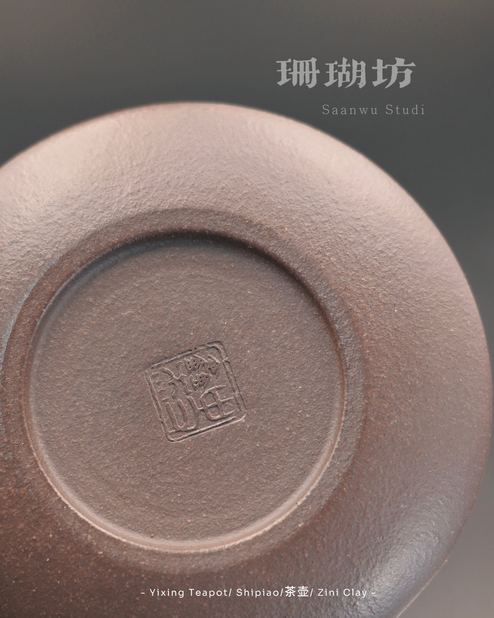 Detail of carved plum blossom pattern on Yixing teapot lid