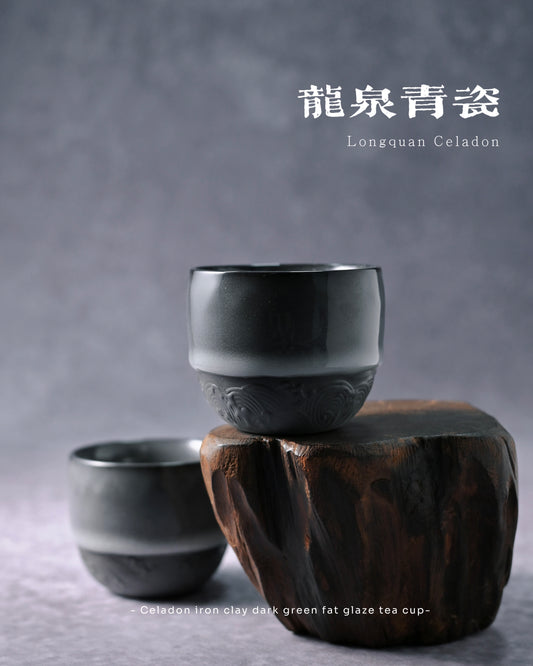 Hand-carved wave pattern encircling unglazed lower section of traditional Chinese tea cup