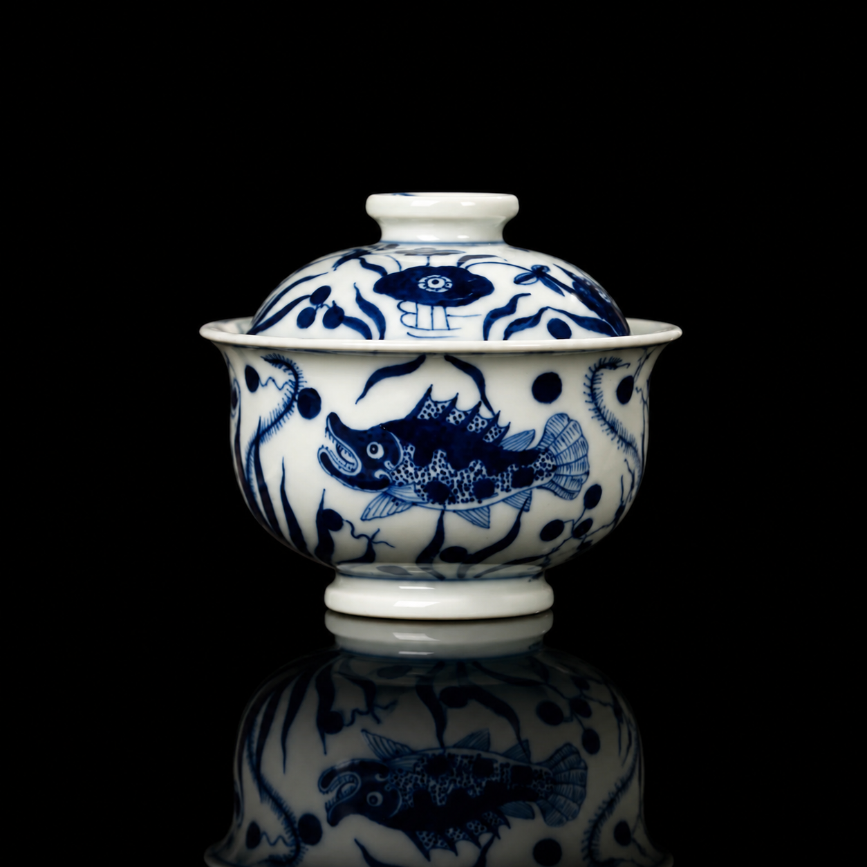 Hand-Painted Blue and White Porcelain Gaiwan with Fish and Aquatic Plants in a front studio shot.