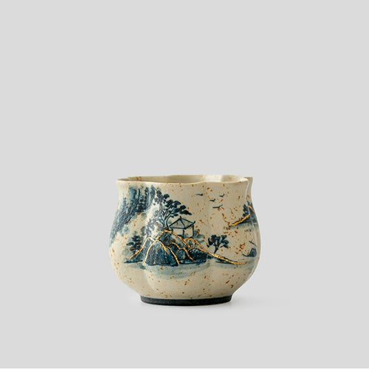 Hand-painted Blue and White Porcelain Petal-shaped Teacup with Landscape Design