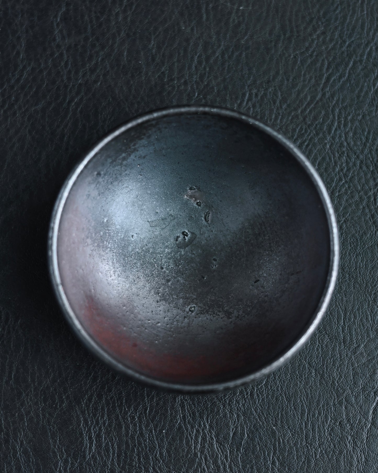 Substantial hand-thrown ceramic body providing warm weight and comfortable grip