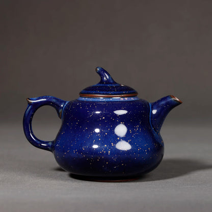 Top-down view of Jun kiln starry blue lid and finial surrounded by crystalline glaze flecks