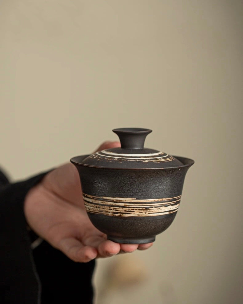 Primitive style gaiwan with unglazed surface, showcasing natural clay body and wood-fired imperfections