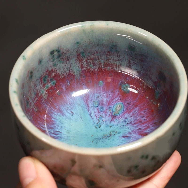 Classic rounded Luohan shape teacup made of handcrafted Jun ware with Phoenix Tail glaze pattern.