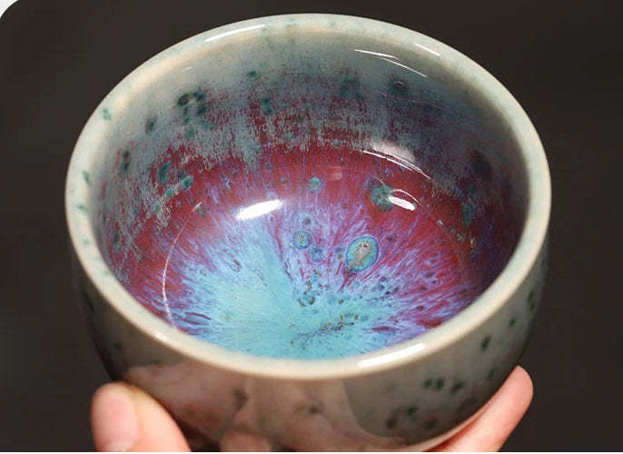 120ml handcrafted Jun Ware Luohan teacup held in hand, showing comfortable grip and generous capacity.