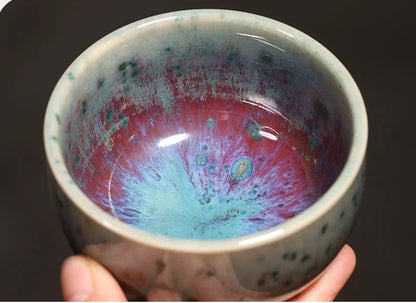 120ml handcrafted Jun Ware Luohan teacup held in hand, showing comfortable grip and generous capacity.