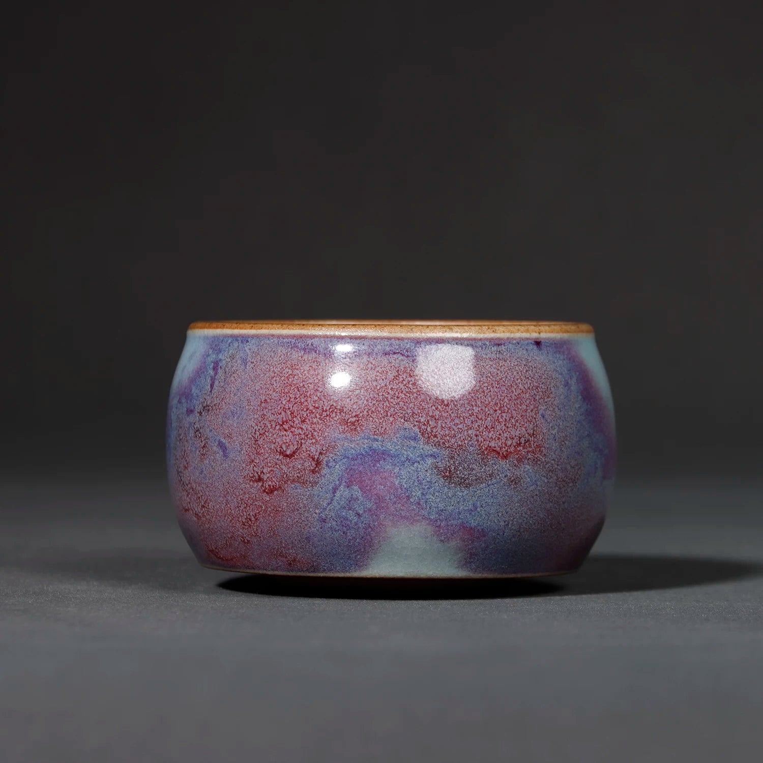 Handcrafted Jun Ware Starry Galaxy Violet Yuanrong Porcelain Teacup 110ML in a studio shot.