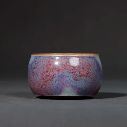 Handcrafted Jun Ware Starry Galaxy Violet Yuanrong Porcelain Teacup 110ML in a studio shot.