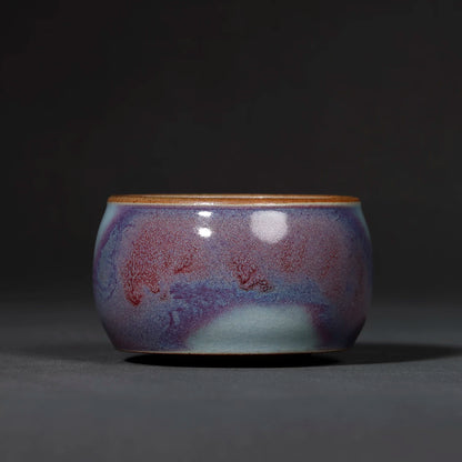 Close-up of the vivid Starry Galaxy Violet glaze and starry mottled pattern on the Jun ware teacup.