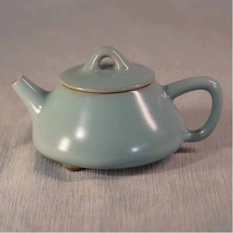 Close-up of bridge finial lid and celestial blue crackle glaze on handcrafted Ru Ware Shipiao teapot