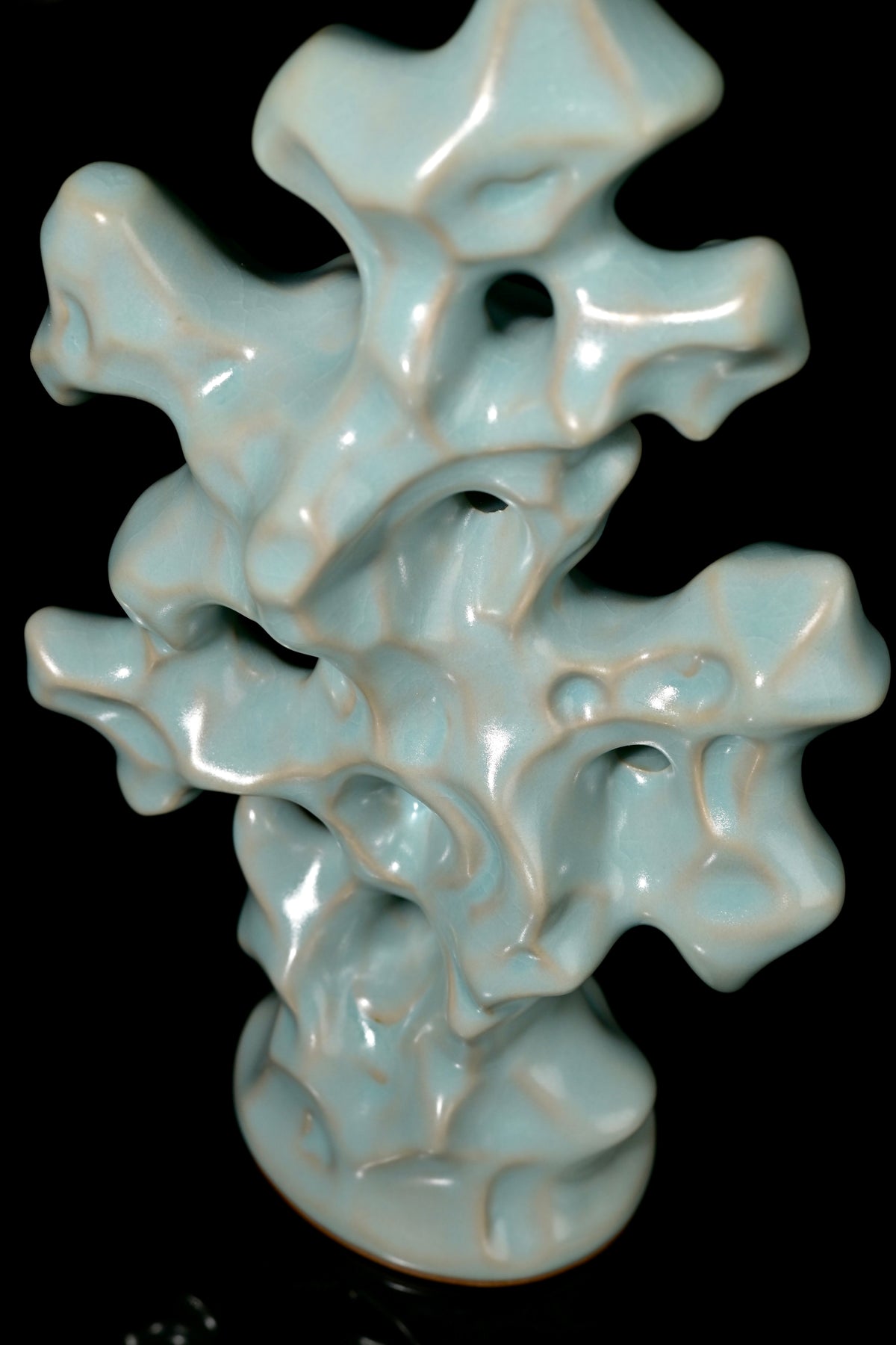 Front view of handcrafted Ru Ware Taihu Lake stone sculpture showing organic natural openings