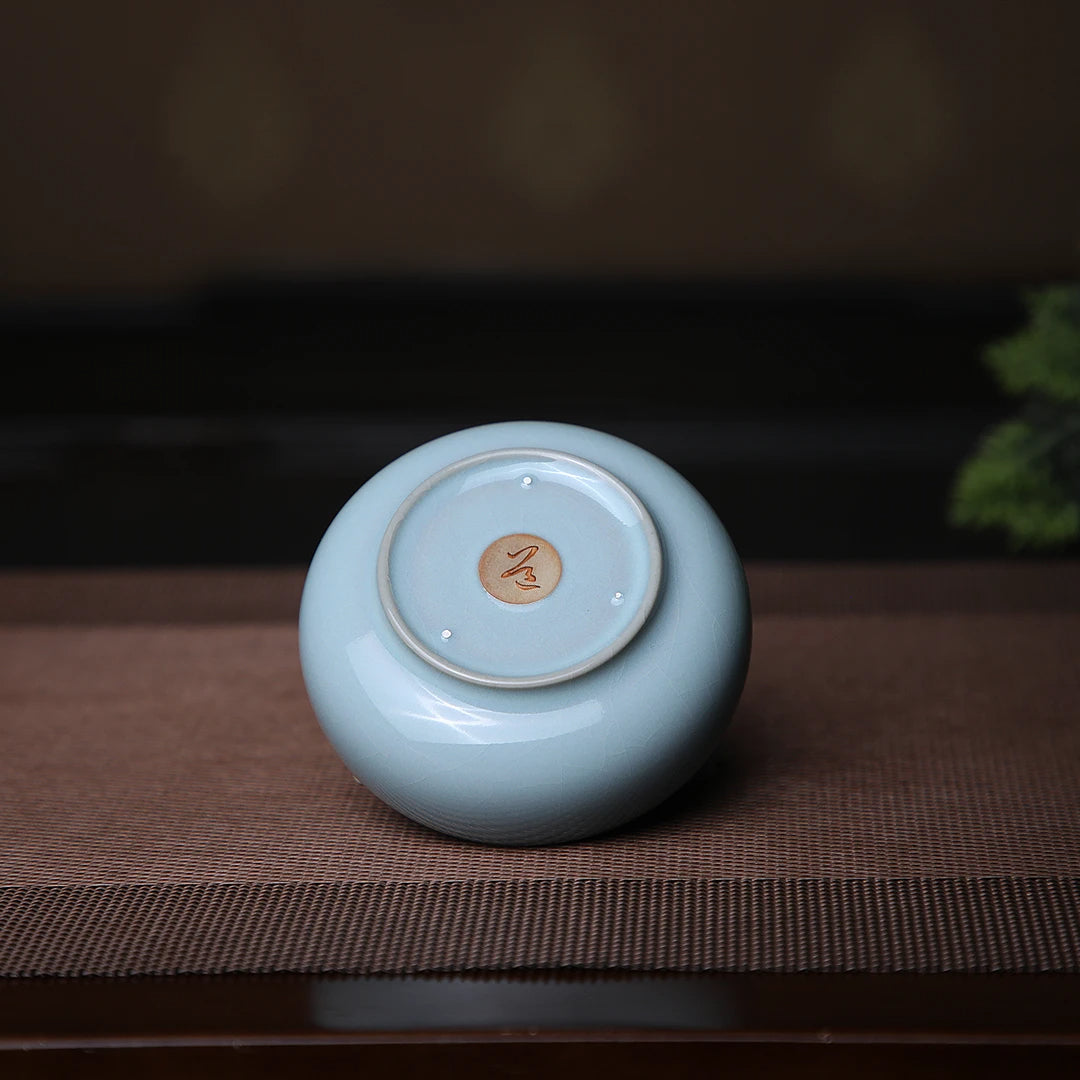 Traditional Chinese Ru Kiln sky blue Pu'er tasting cup showing jade-soft tianqing glaze texture