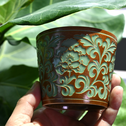 Authentic Longquan celadon from Fujian: 260ml peony-vine carved teacup with jade-like plant ash glaze, honoring 1000-year celadon traditions.