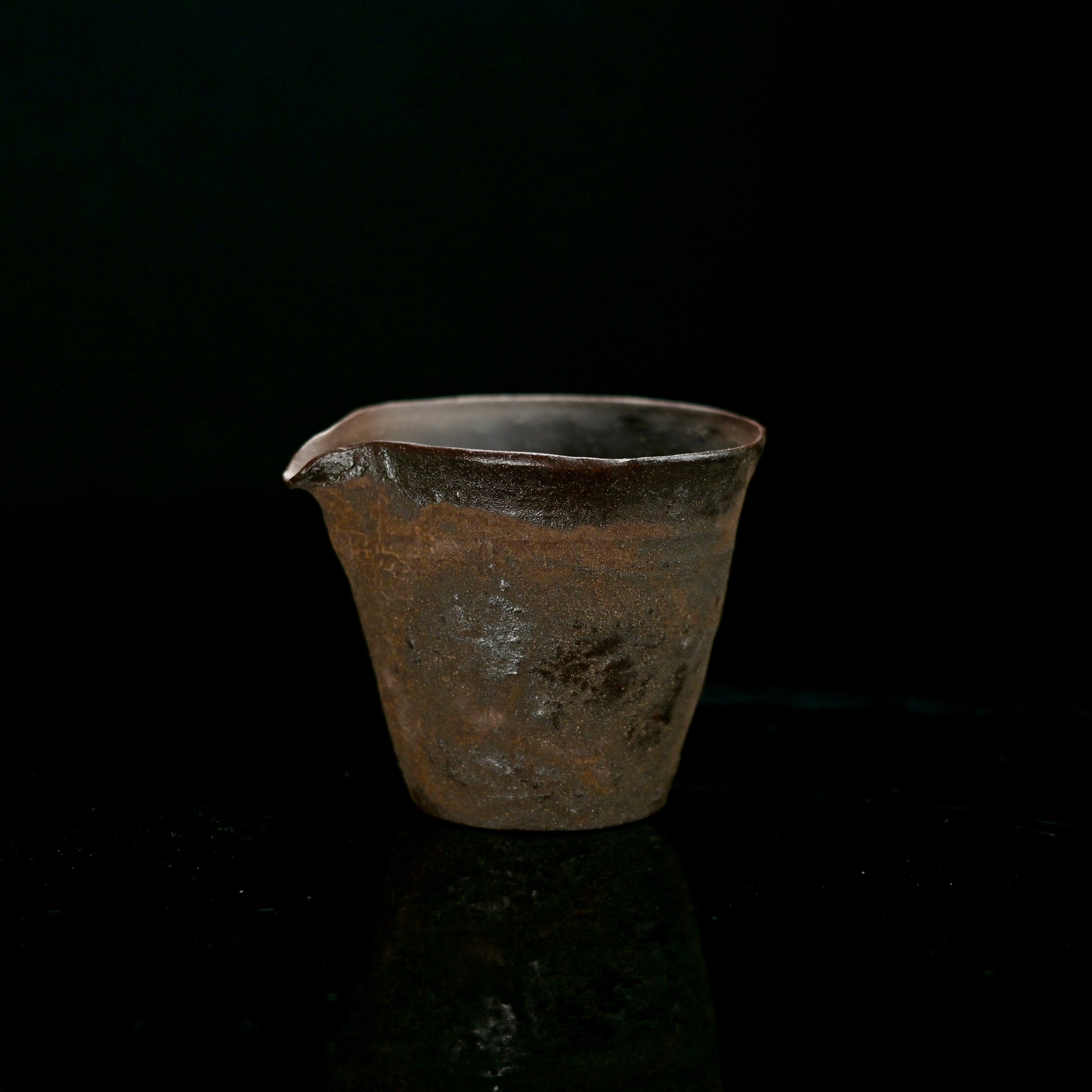 Traditional fairness cup (cha hai) ensuring even tea distribution during ceremonial serving