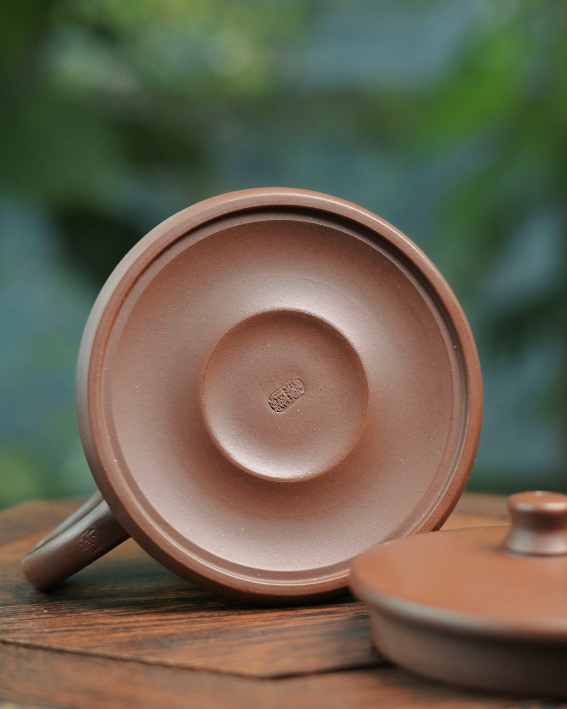 Close-up view of Dicao Qing clay texture on handmade Yixing teapot