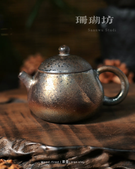Heavy ash deposit teaware with thick glass-like accumulation where embers lingered