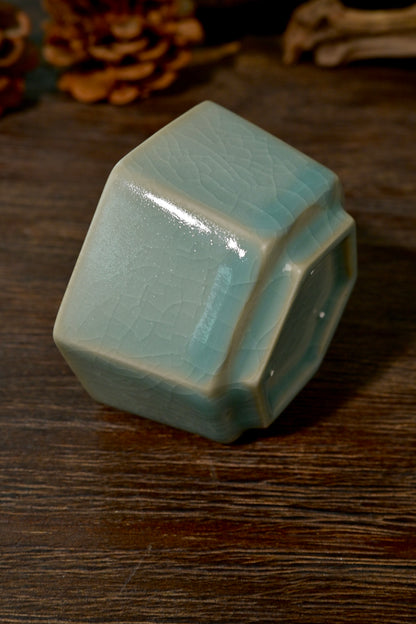 Side profile of Ru kiln sky-blue hexagonal cup showing clean geometric lines and glaze highlights