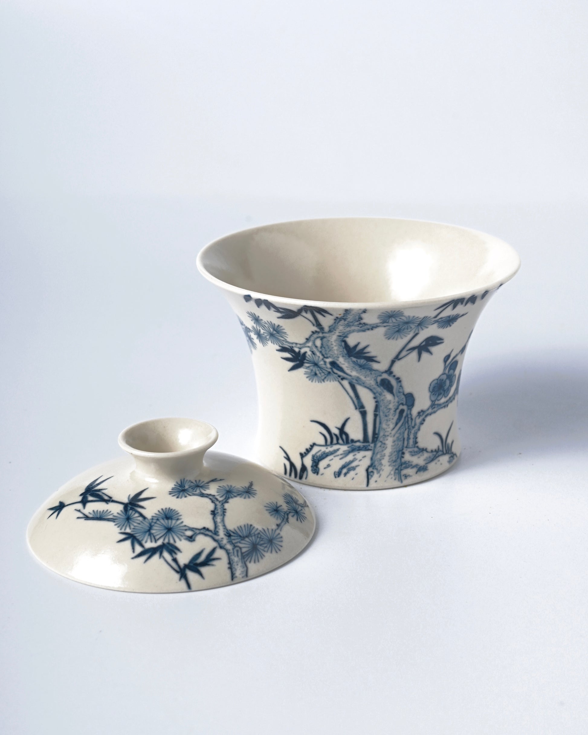 Horseshoe-shaped covered bowl with cobalt blue patterns