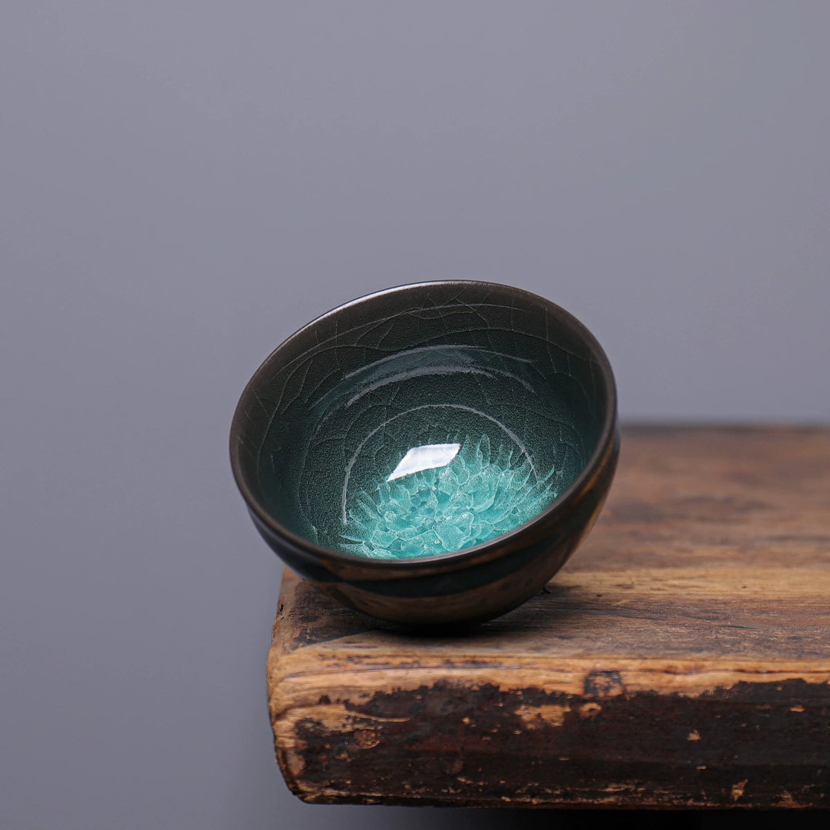 Handmade Longquan Celadon 135ml master tasting cup displaying glossy jade glaze and crackle lines
