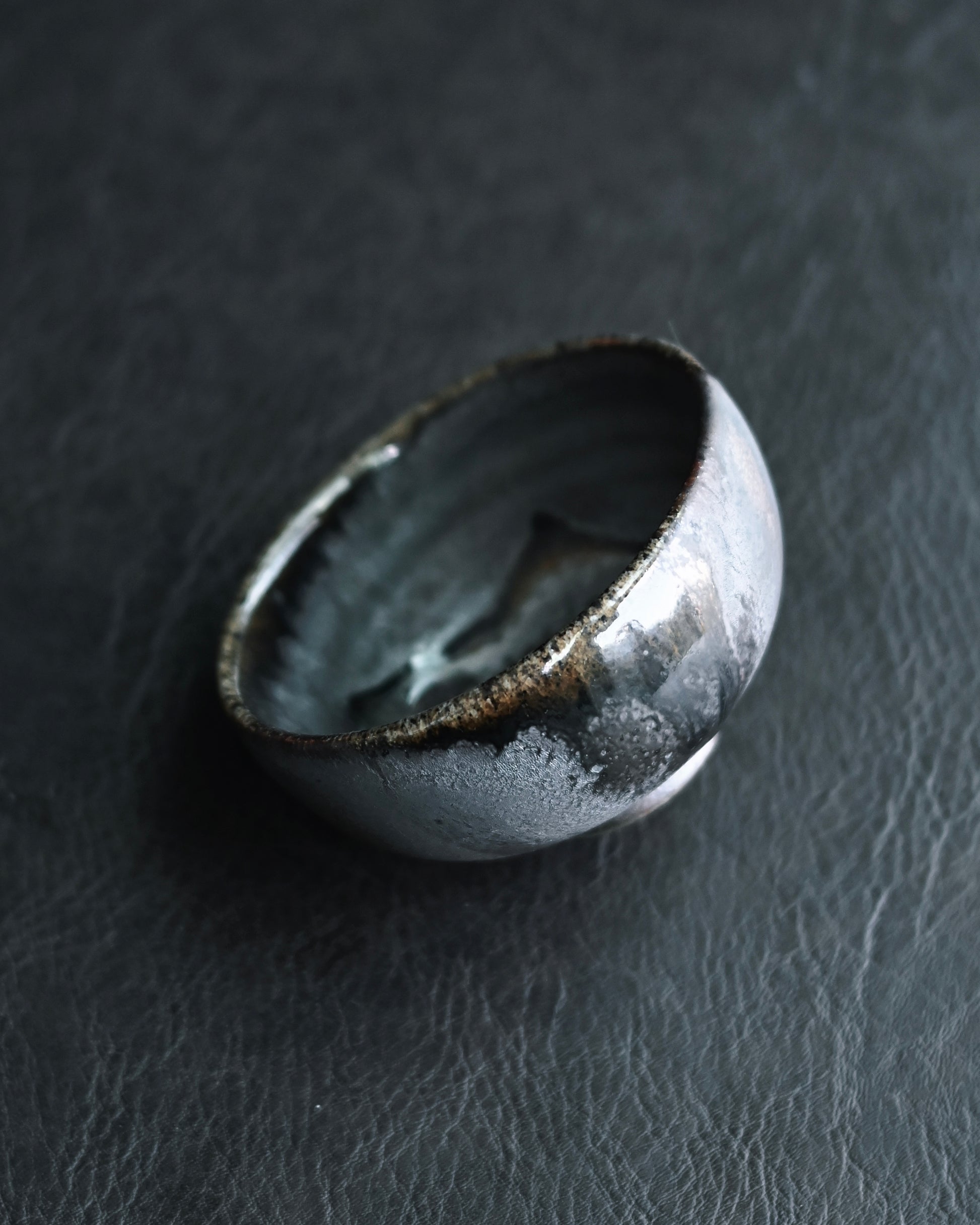 Iridescent fire markings on unglazed surfaces showing metallic color reflections