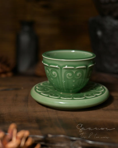 Handcrafted Longquan celadon teacup and saucer with plum green glaze, ideal for green tea, oolong tea and Chinese tea rituals.