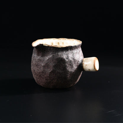 Japanese Karatsu ceramic cup serving as tea pitcher during tea ceremony