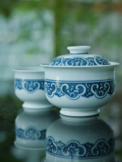 Master-crafted Jingdezhen gaiwan set with 12-step hand-painting process, three-layer gradient washes, and 1320°C reduction firing for imperial-quality blue-and-white porcelain.