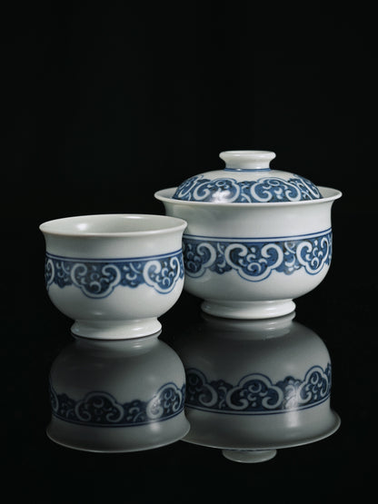 Artisanal Jingdezhen gaiwan set featuring 0.3mm cobalt outlining, triple-layer gradient painting, and high-temperature reduction firing for museum-quality blue-and-white ware.