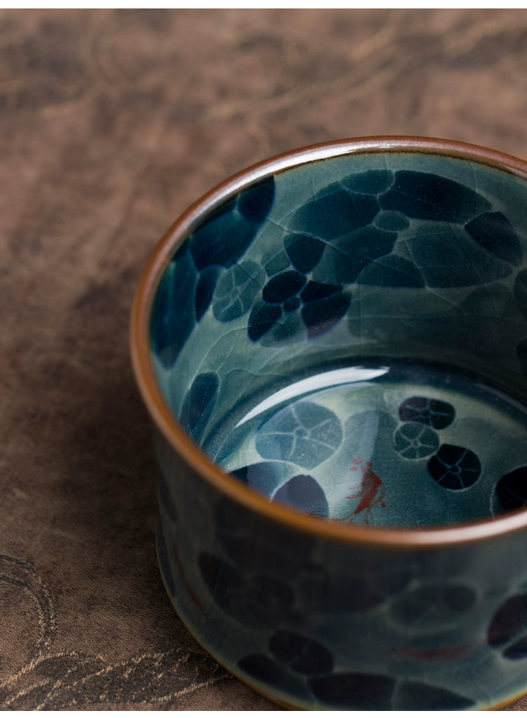 A hand-painted Jingdezhen blue and white ceramic underglaze tea cup showcasing intricate detailing and classic Chinese artistry, ideal for daily use or collection.