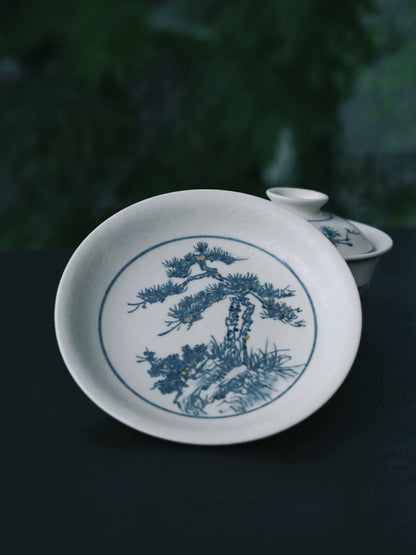 Matte-finish blue-and-white gaiwan showcasing Jingdezhen's dual mastery: scientific kaolin clay formulation and artistic hand-brushwork capturing pine essence in classic 'heaven-earth-man