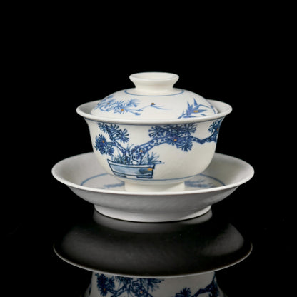 Symbolic pine trees adorn this matte glaze gaiwan - hand-painted in Jingdezhen using ancient methods, representing longevity and resilience in Chinese ceramic art.