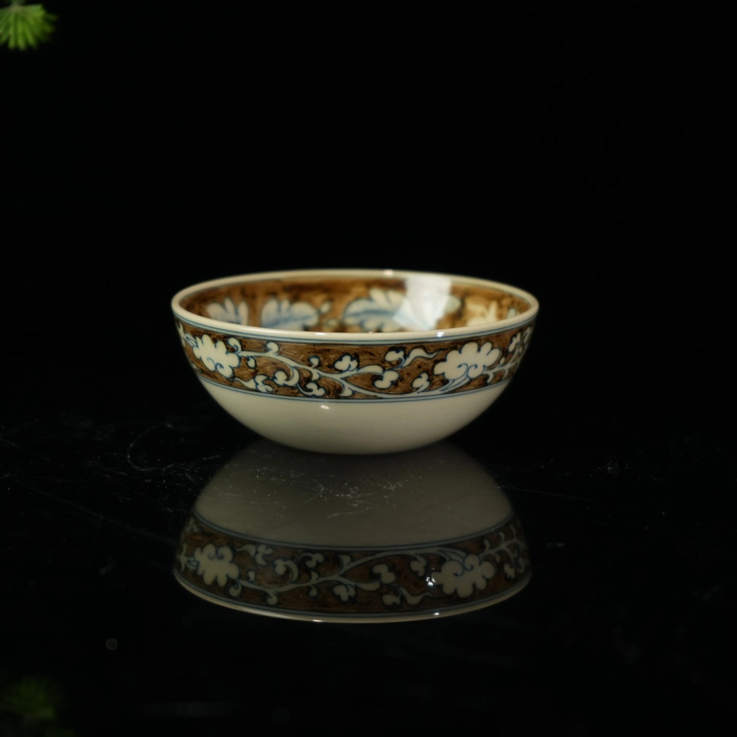 Hand-painted Jingdezhen porcelain teacup featuring a majestic phoenix and peony design in underglaze blue