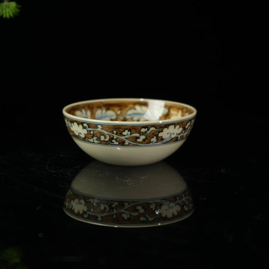 Hand-painted Jingdezhen porcelain teacup featuring a majestic phoenix and peony design in underglaze blue