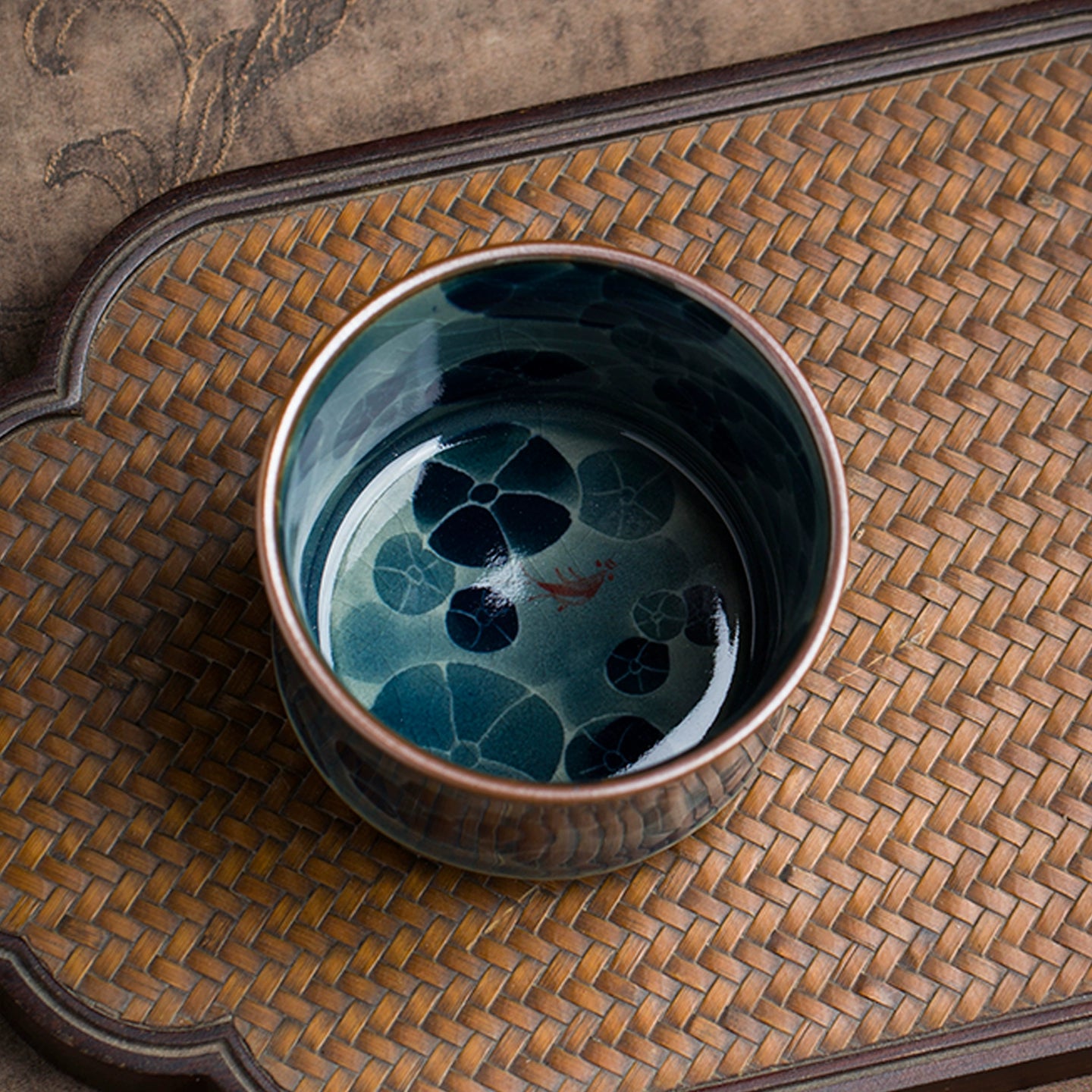 A handmade Jingdezhen blue and white underglaze porcelain teacup with fine craftsmanship, balanced proportions, and a timeless floral motif inspired by ancient kilns.