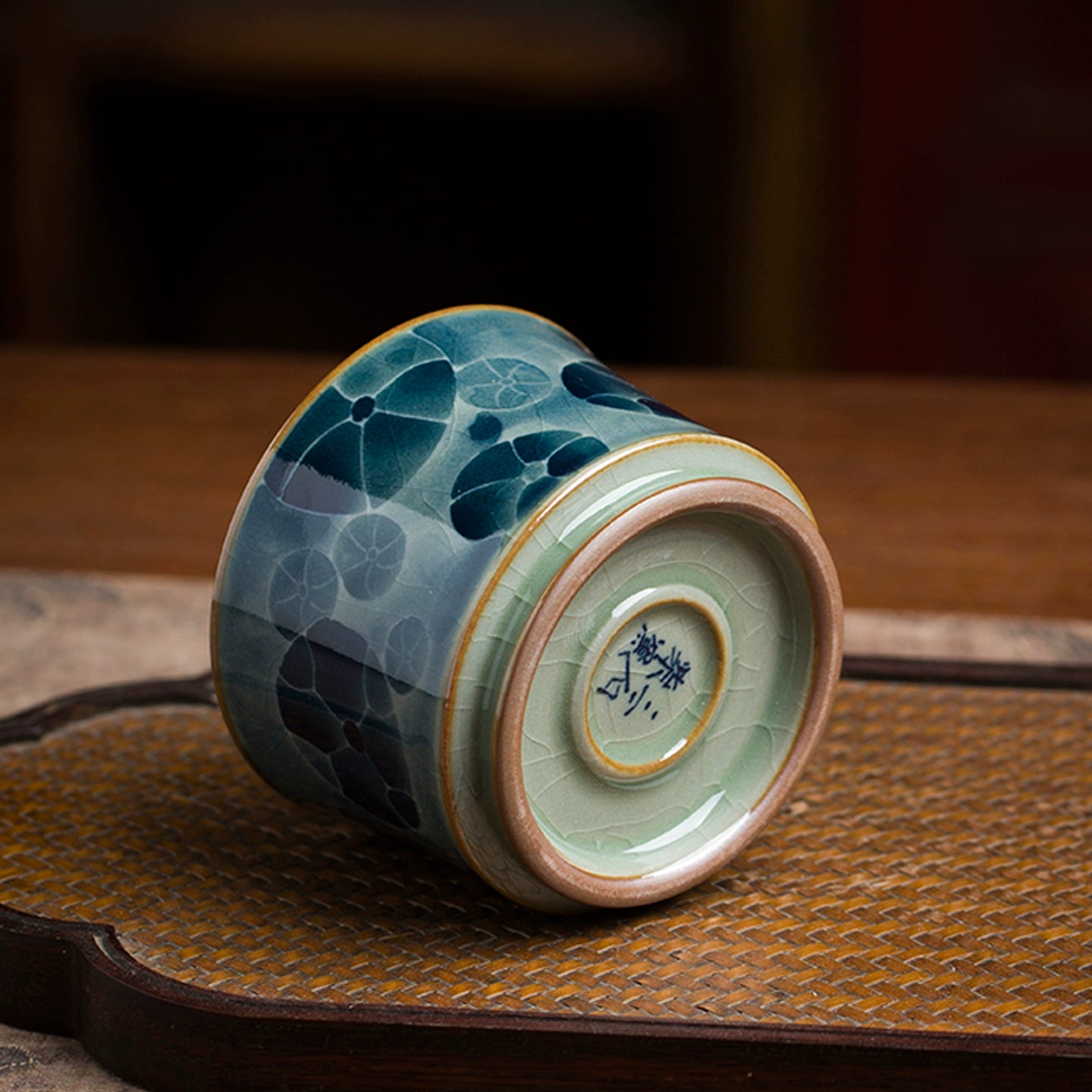 A Jingdezhen painted blue and white underglaze porcelain tea bowl with classic cobalt artwork, fired at high temperatures for durability and a refined aesthetic.