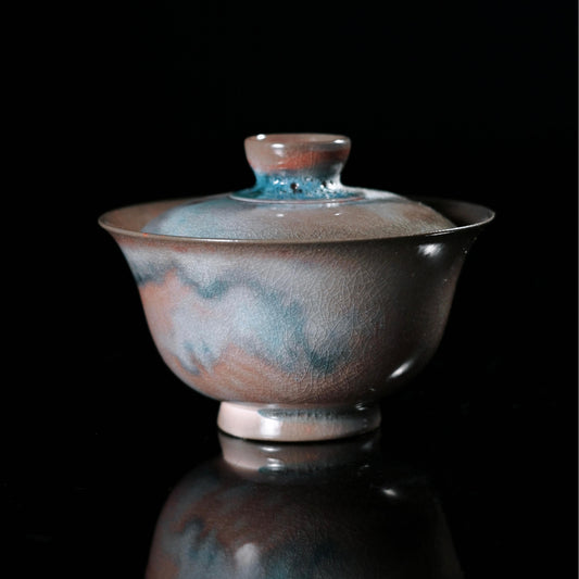 Jingdezhen wood-fired gaiwan with crystalline glaze resembling shimmering galaxy patterns and natural crackle texture