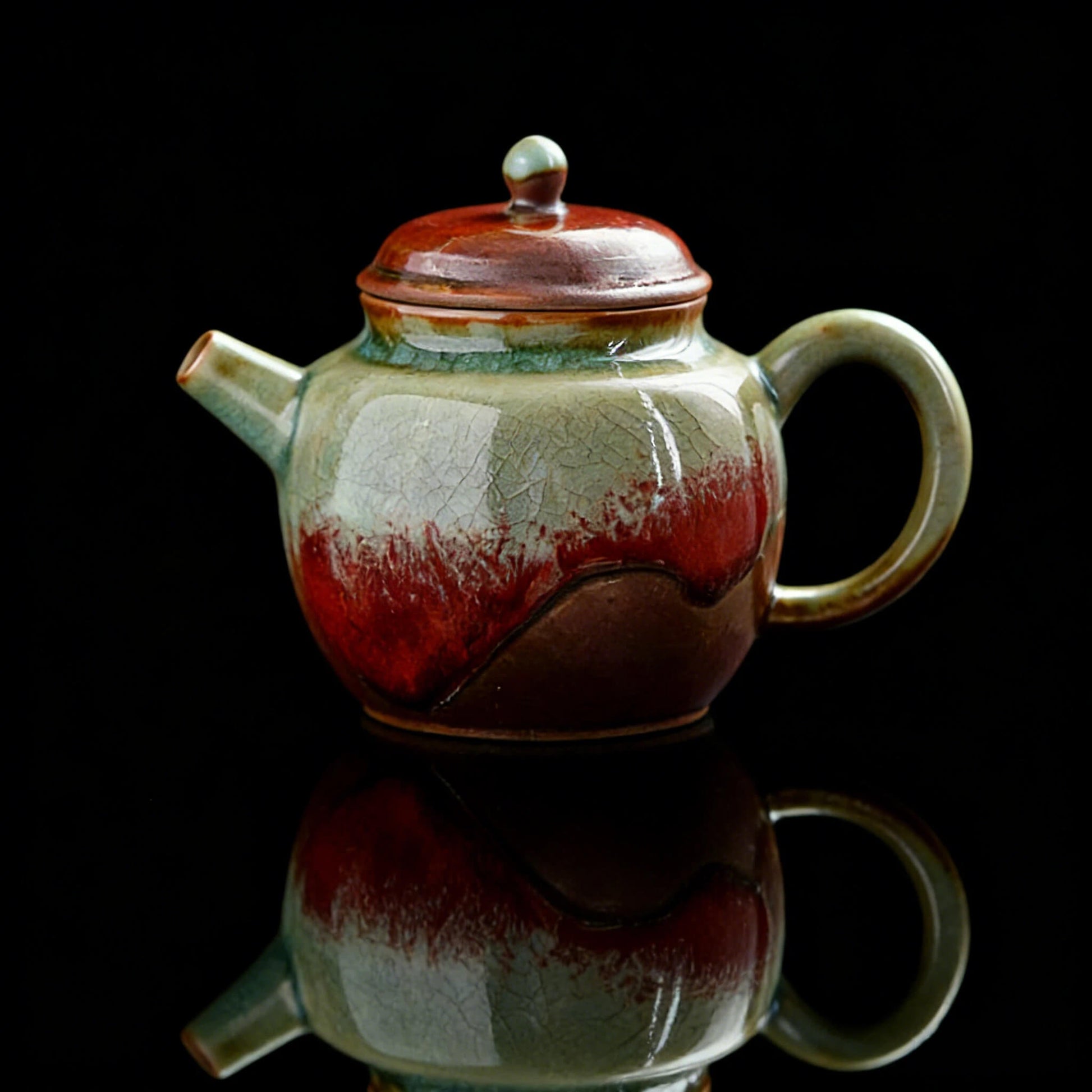 Unique Jingdezhen wood-fired teapot with underglaze red glaze shaped by natural kiln flames