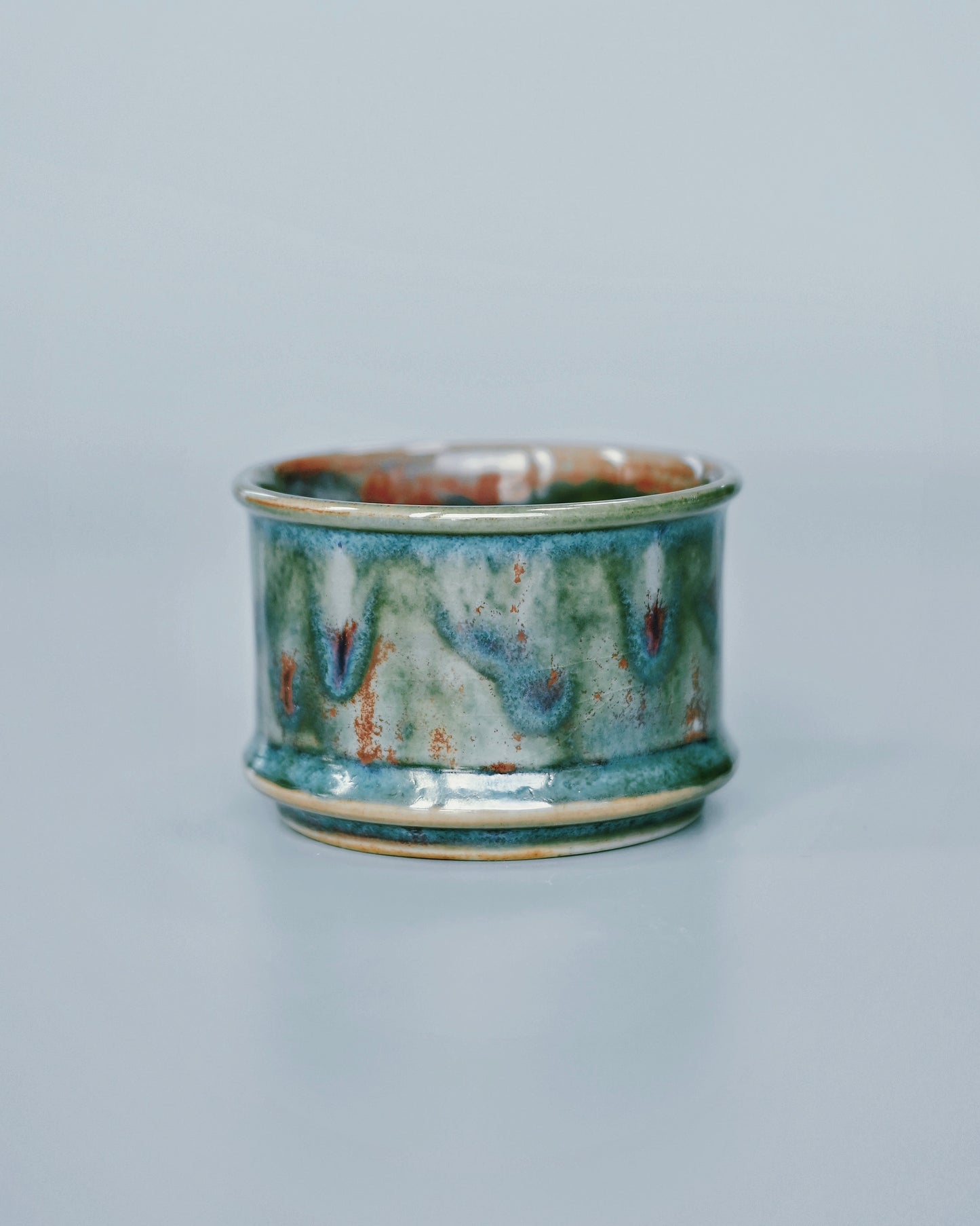 Handcrafted Jun ware teacup with magical green flambé glaze, horsehoof shape, and crackled texture for Chinese tea ceremony