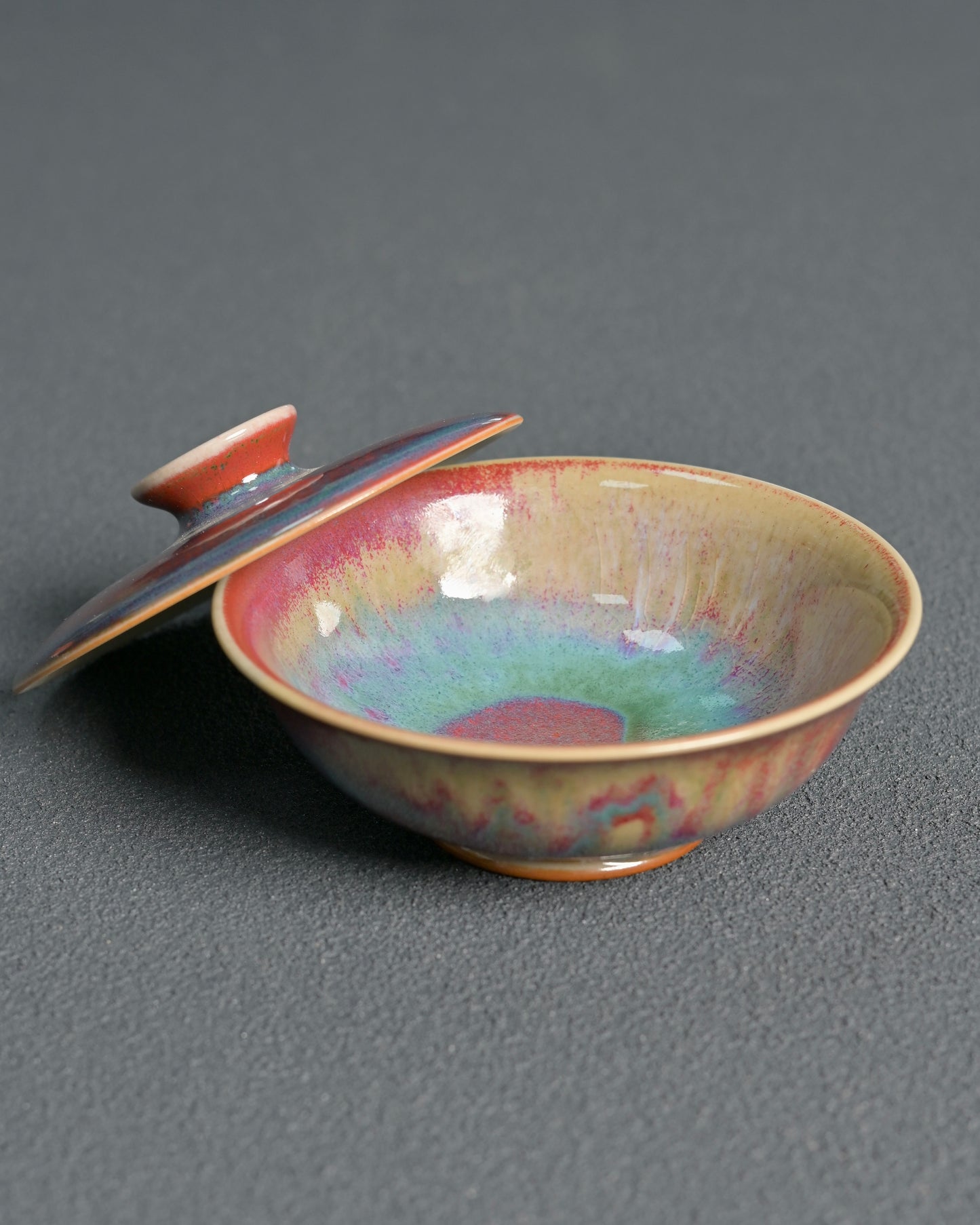 Close-up of Jun ware kiln-transformed glaze with red and blue color variations