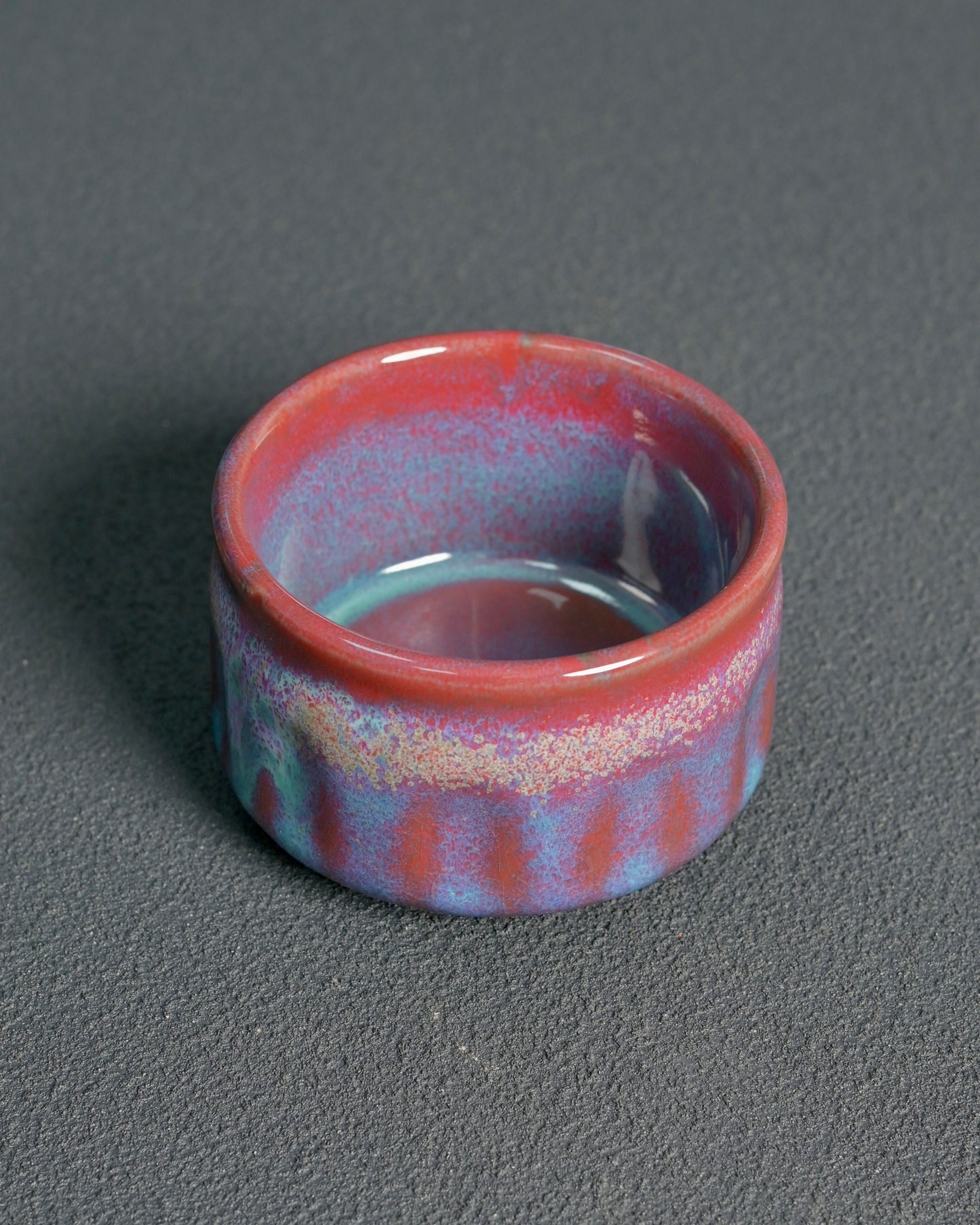 Chinese Jun ware kiln transformation colors showing natural mineral fusion in lavender, iron-red and blue-green hues