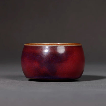 Close-up of the mottled texture and vibrant colors of the Lu Jun glaze on the teapot.
