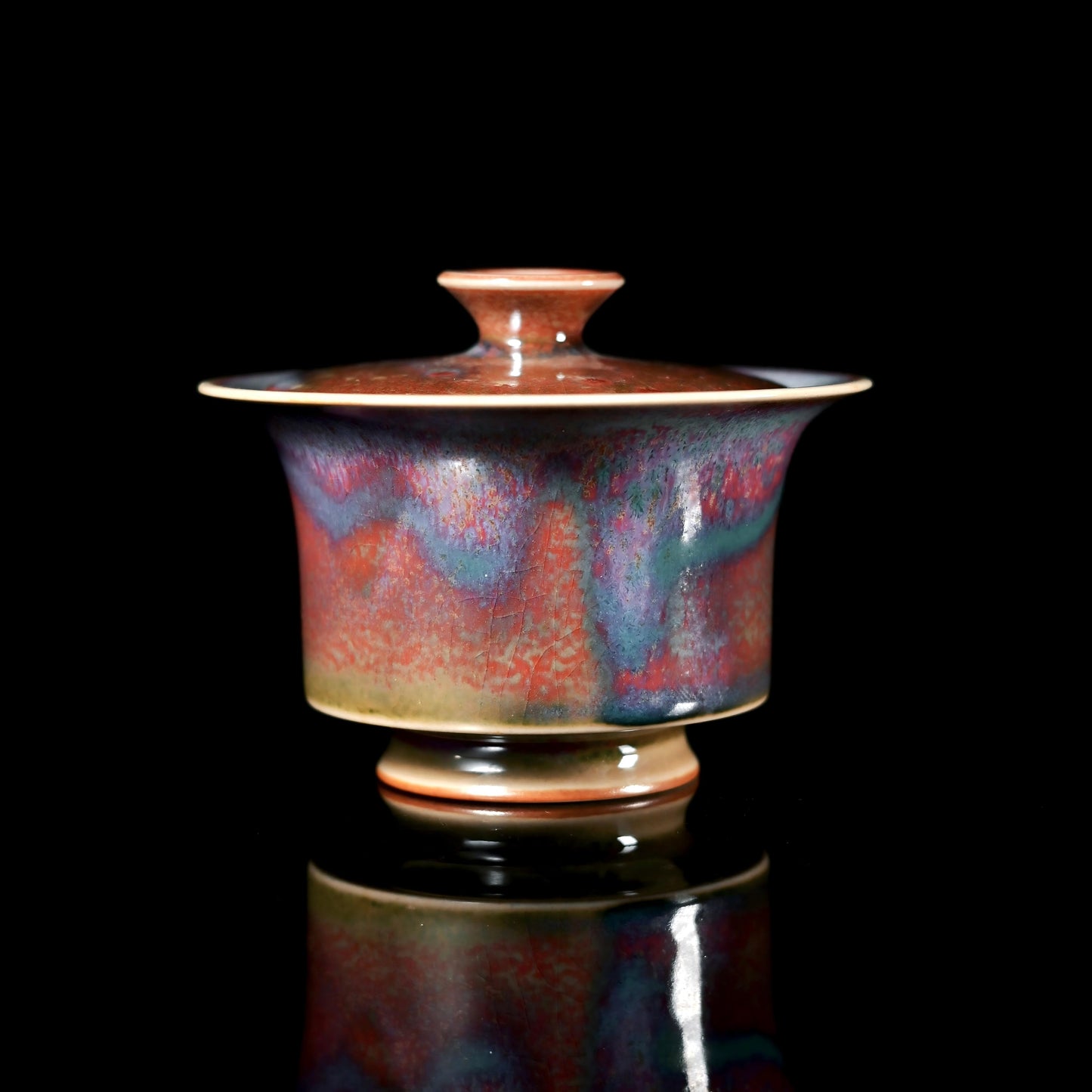 Jun ware horseshoe-shaped lidded bowl with kiln-transformed glaze in flowing colors
