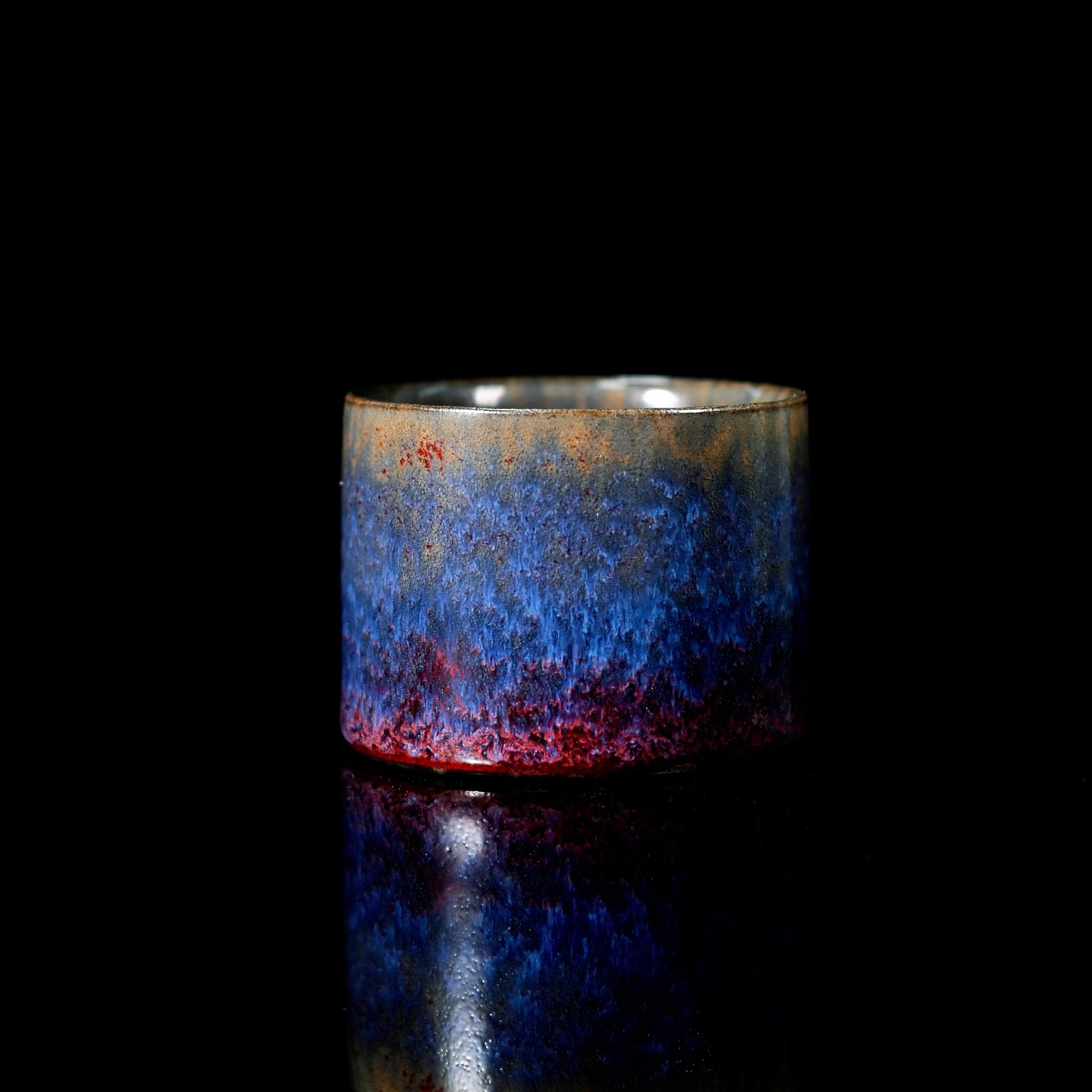Jun ware purple thumb-ring cup featuring traditional copper-iron glaze kiln transformation