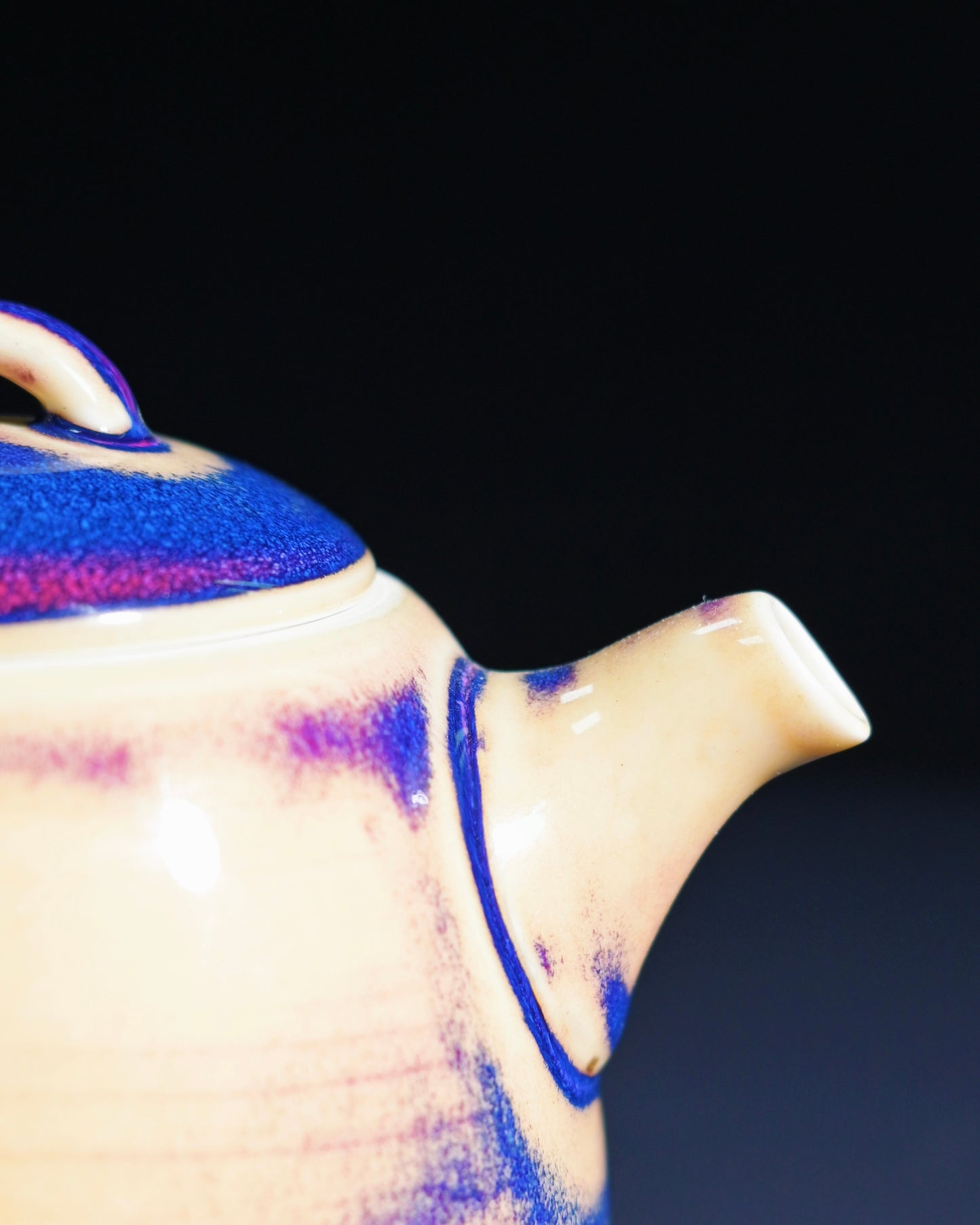 Detail of Jun porcelain glaze showing blue purple and beige kiln transformation